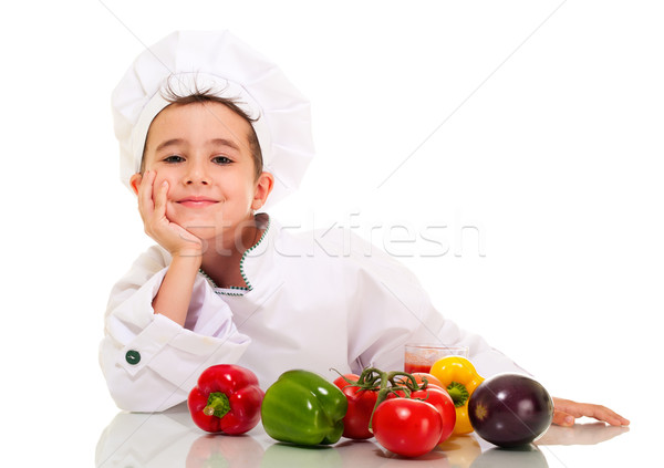 Little happy boy chef in uniform with vegatables lean on hand Stock photo © pekour