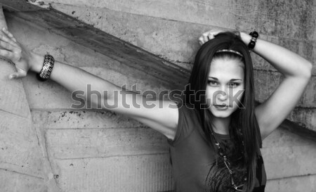 Grayscale portrait of the girl by the concrete wall Stock photo © pekour