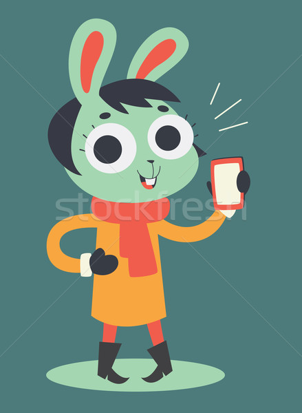 Cute Bunny Girl Holding a Cell Phone Stock photo © penguinline