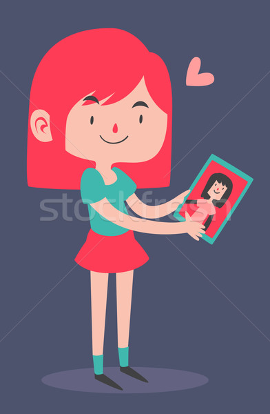 Cute Girl Holding her Girlfriend's Portrait Stock photo © penguinline