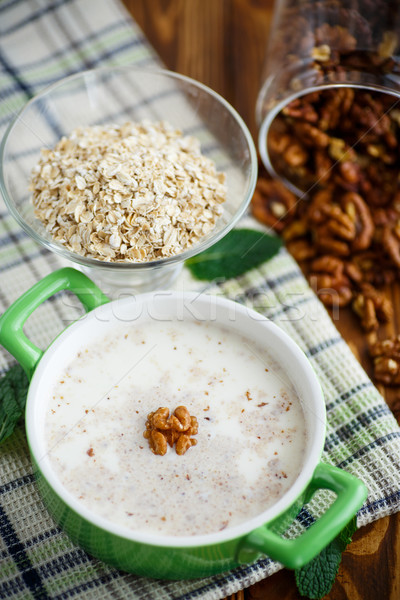 Milk oatmeal with walnuts  Stock photo © Peredniankina