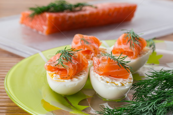 Boiled eggs with salted salmon Stock photo © Peredniankina