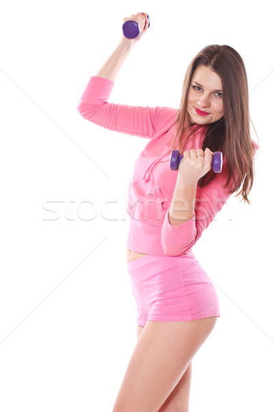 girl is engaged in fitness with dumbbells Stock photo © Peredniankina