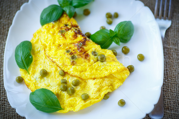 scrambled eggs with green peas Stock photo © Peredniankina