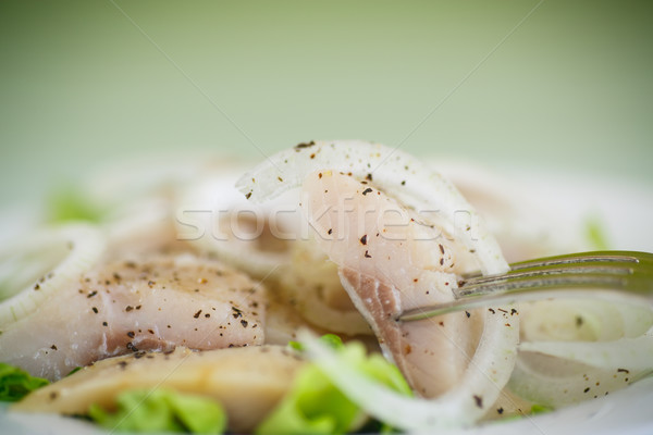 Stock photo: pieces of salted herring with onions