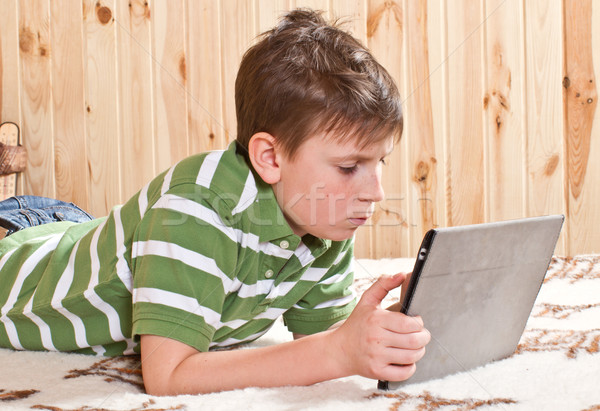 boy teenager with tablet computer Stock photo © Peredniankina