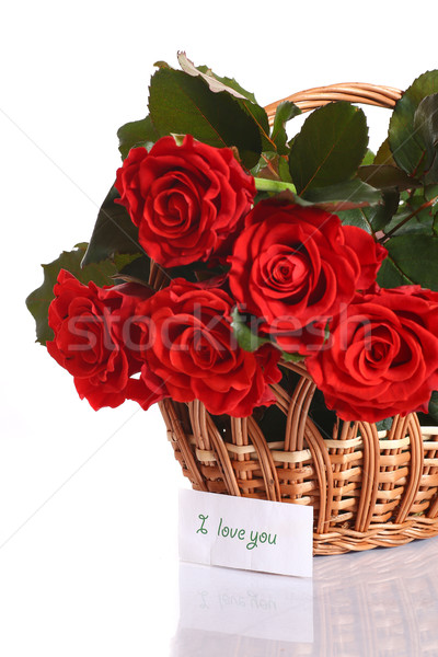 Virágcsokor vörös rózsák gyönyörű kosár fehér nő Stock fotó © Peredniankina