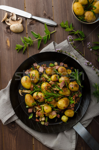 Cowboy potatoes with bacon and herbs Stock photo © Peteer