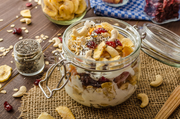 Homemade yogurt with granola, dried fruit and nuts bio Stock photo © Peteer
