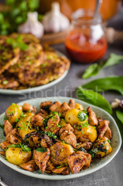 Potato pancakes, fried chicken with potatoes Stock photo © Peteer