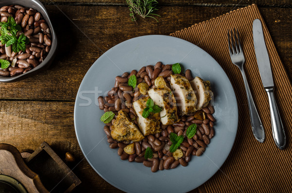 Roasted chicken breast with herbs and stewed beans Stock photo © Peteer