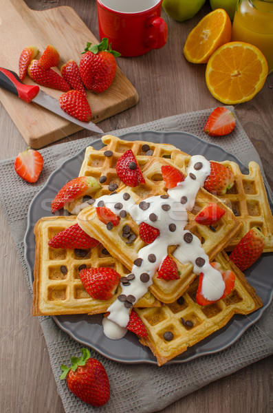 Homemade waffles with maple syrup and strawberries Stock photo © Peteer