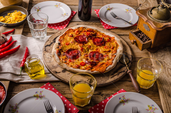 Rustic salami pizza with chorizo Stock photo © Peteer