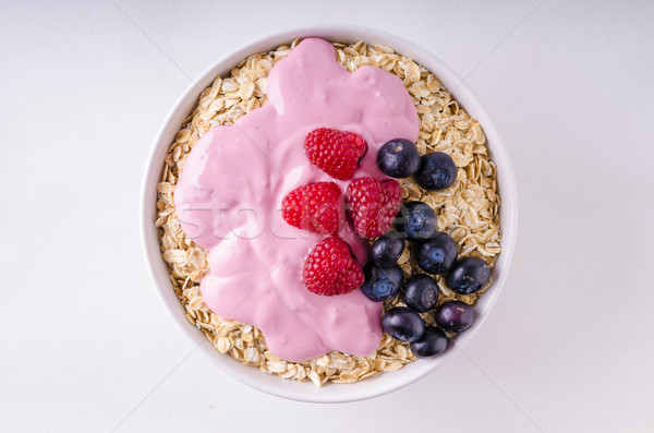 Oatmeat in bowl with yogurt and berries Stock photo © Peteer