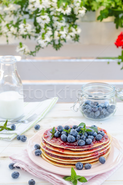 Vintage pancakes outside garden with blueberries Stock photo © Peteer