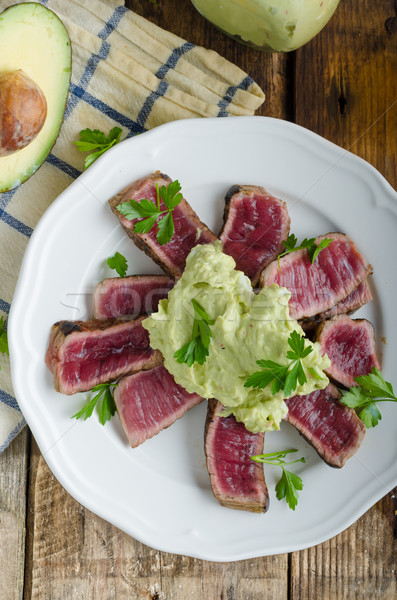 Beef steak with avocado dip and herbs Stock photo © Peteer