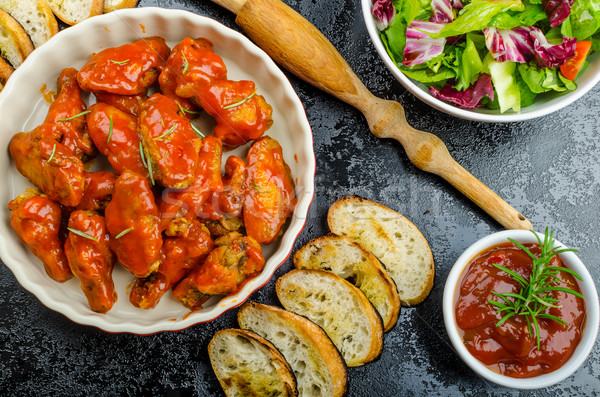 Hot chicken wings, habanero souce, salad Stock photo © Peteer
