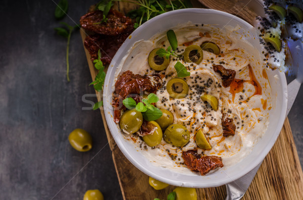 Fresh cheese with olives, dried tomatoes Stock photo © Peteer