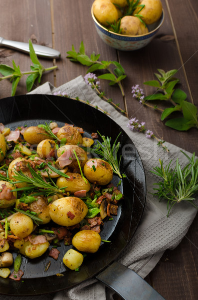 Cowboy potatoes with bacon and herbs Stock photo © Peteer