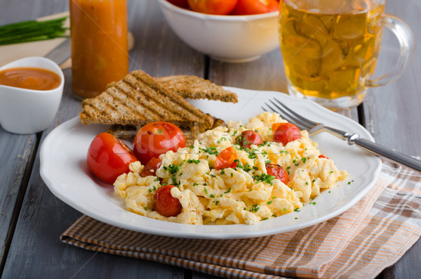 Scrambled eggs with baked tomatoes and chives, panini Scrambled eggs with baked tomatoes Stock photo © Peteer