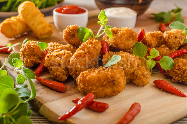 Kip popcorn eigengemaakt aardappel hete saus Stockfoto © Peteer