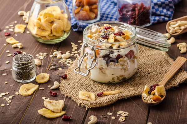 Homemade yogurt with granola, dried fruit and nuts bio Stock photo © Peteer