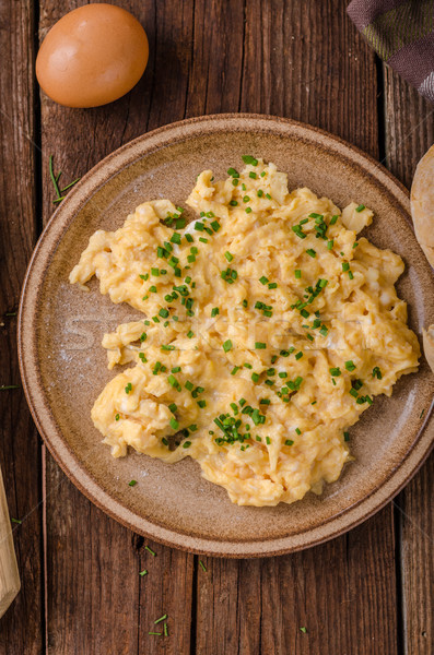 Scrambled eggs with herbs Stock photo © Peteer