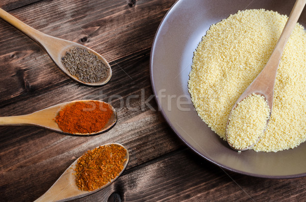 Spice on spoon with bowl of couscous Stock photo © Peteer