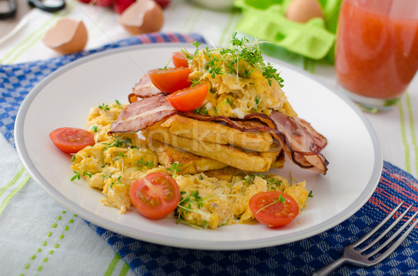 Scrambled eggs with bacon and French toast Stock photo © Peteer