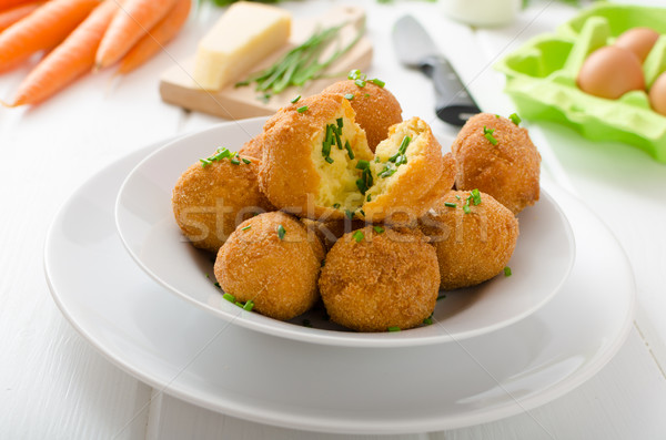 Homemade potato croquettes with parmesan and chives Stock photo © Peteer