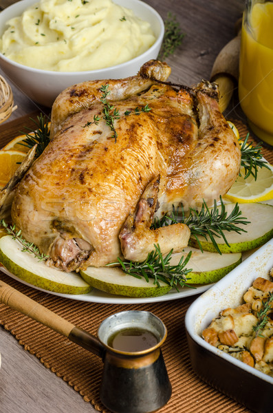 Feasting - stuffed roast chicken with herbs Stock photo © Peteer