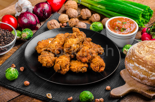 Spicy breaded chicken wings with homemade bread Stock photo © Peteer