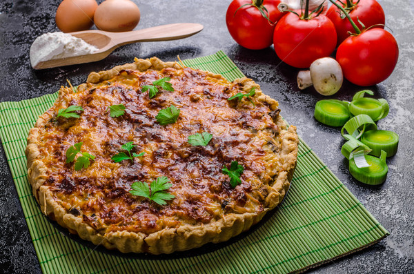 Home French quiche stuffed with mushrooms, tomato and leek Stock photo © Peteer