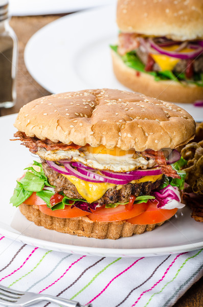 Beef burger, red onion and fried egg Stock photo © Peteer