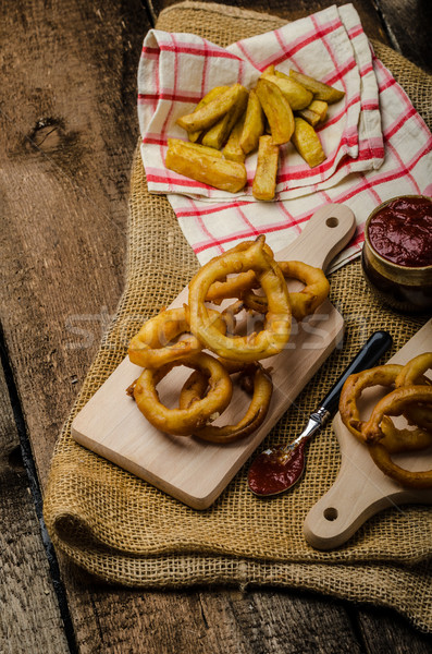 Stock photo: Onion rings, hot dip, french fries and Czech beer