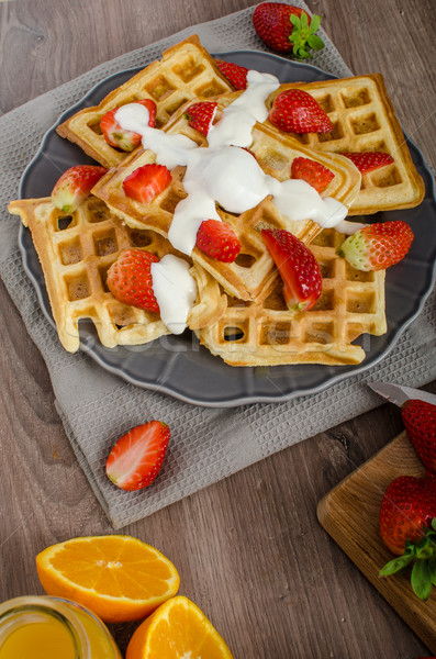 Homemade waffles with maple syrup and strawberries Stock photo © Peteer