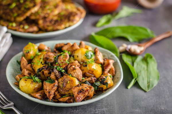 Potato pancakes, fried chicken with potatoes Stock photo © Peteer