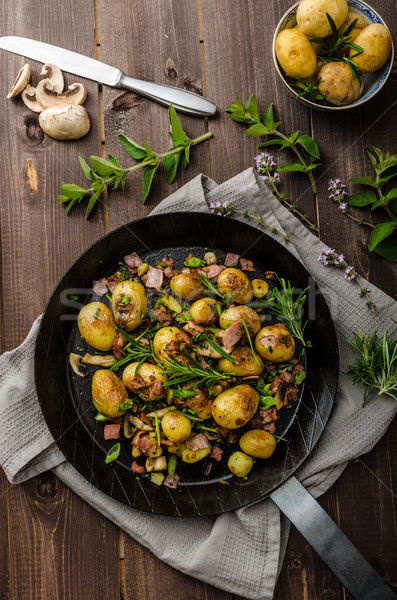 Cowboy potatoes with bacon and herbs Stock photo © Peteer