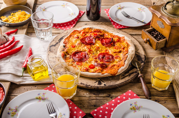 Rustic salami pizza with chorizo Stock photo © Peteer