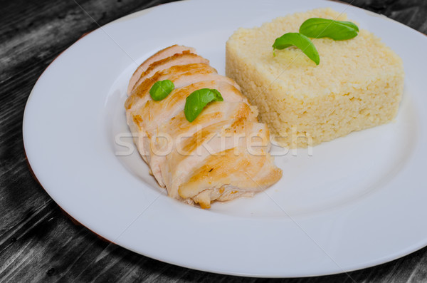 Grilled chicken breast with couscous and basil Stock photo © Peteer