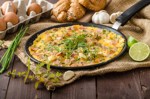 Egg omeletta with ham and herbs Stock photo © Peteer