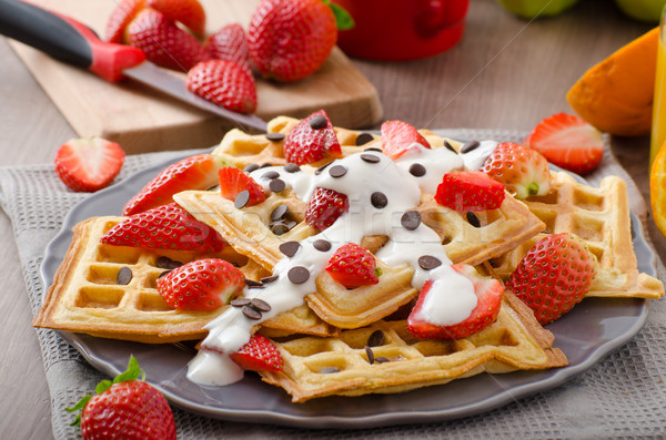 Homemade waffles with maple syrup and strawberries Stock photo © Peteer
