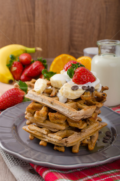 Belgian waffles with chocolate chips and fruits Stock photo © Peteer