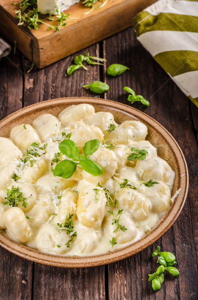 Cheese gnocchi with blue cheese sauce and galic Stock photo © Peteer