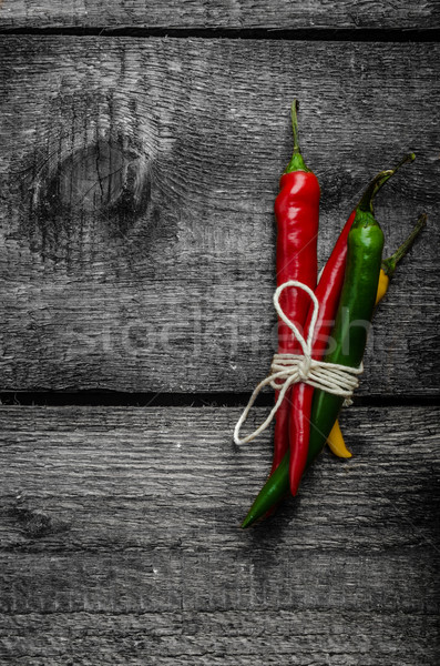 Chilli peppers, wood table, background Stock photo © Peteer