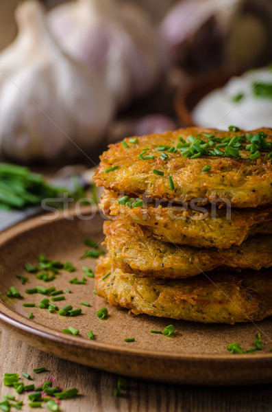 Potato pancakes with sour cream Stock photo © Peteer