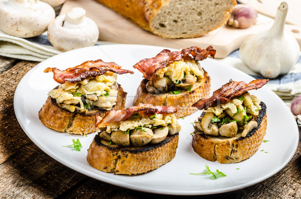 Rustic breakfast - bread toast, mushrooms, eggs Stock photo © Peteer