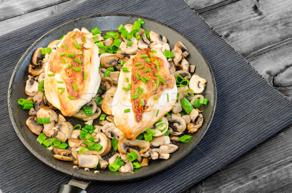 Chicken breast with mushrooms and spring onions on pan Stock photo © Peteer