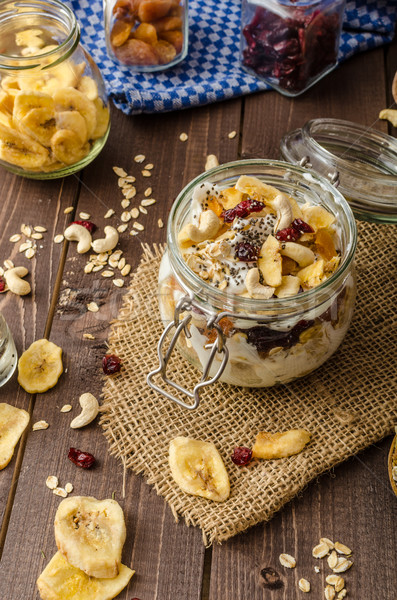 Homemade yogurt with granola, dried fruit and nuts bio Stock photo © Peteer
