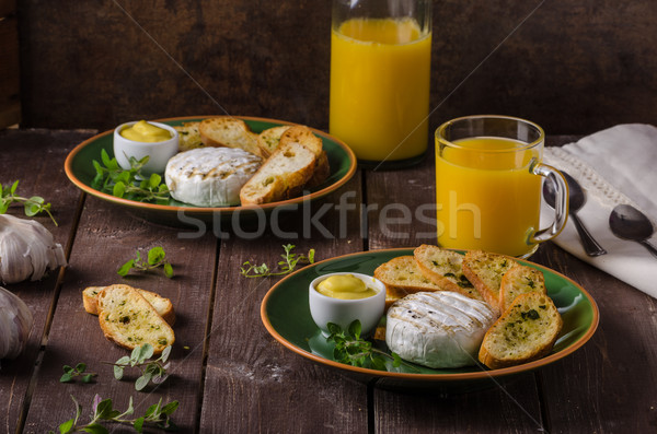 Grilled camembert with toast and juice Stock photo © Peteer